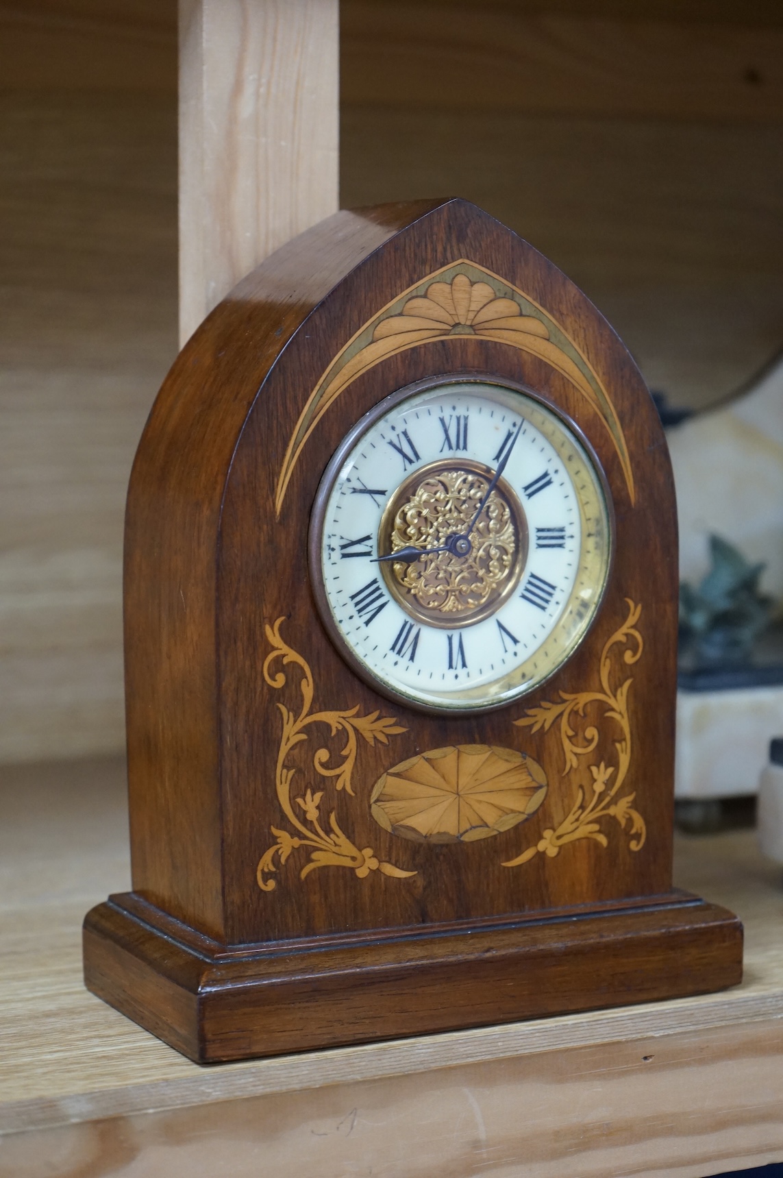 An Edwardian inlaid mahogany lancet shaped eight day mantel timepiece, with key, 23cm high